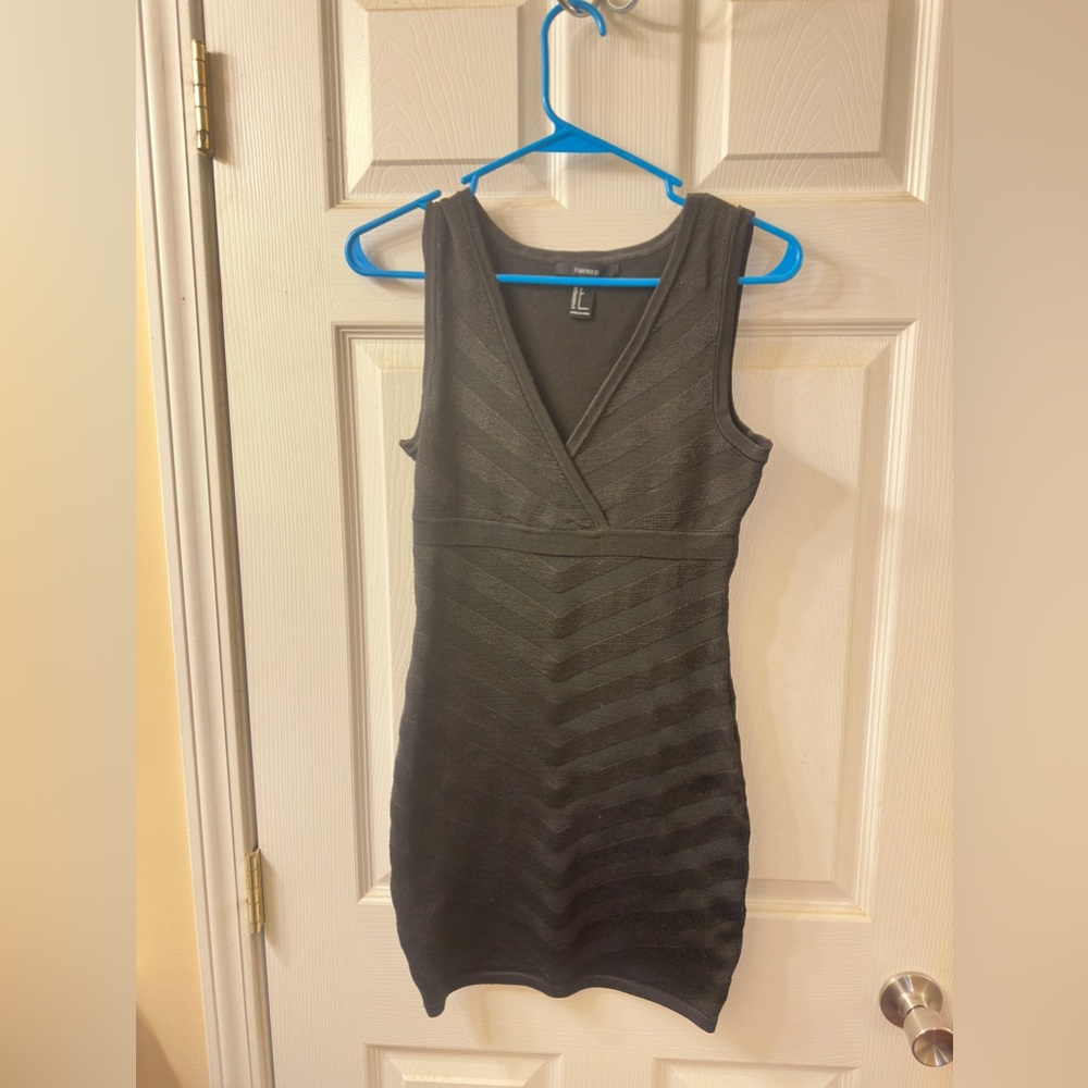 Mini black dress.